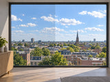 BRUXSAFOL Sonnenschutzfolie AX PLUS 70 Exterior am Fenster – Darstellung links mit, rechts ohne Folie